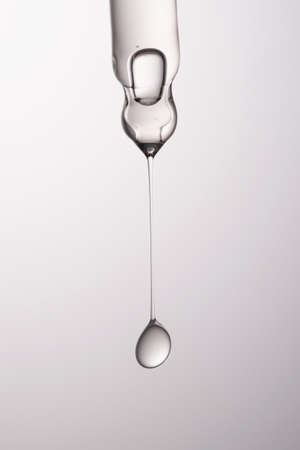 Pipette with serum, gel, oil or other cosmetic product.の写真素材