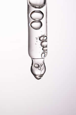 Pipette with serum, gel, oil or other cosmetic product.の写真素材