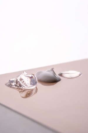 Cream, hyaluronic gel and serum on a beige background.の写真素材