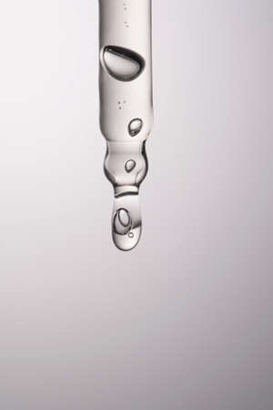 Pipette with serum, gel, oil or other cosmetic product.の写真素材