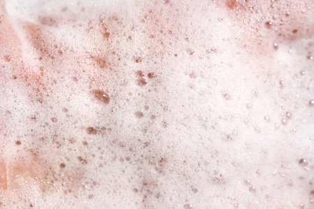Photo of the texture of cosmetic foam or soap on the hand.の写真素材