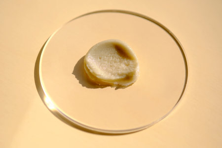 Facial peeling drop swatch on a beige background.の写真素材