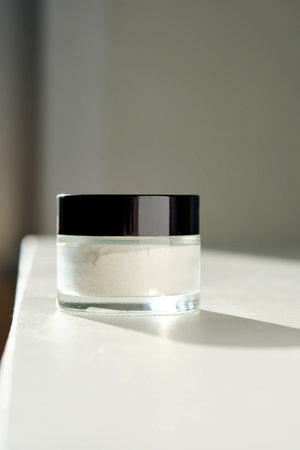 Closed jar of scrub-powder for the face.の写真素材