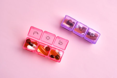 Bright pill box with different pills and vitamins.の写真素材