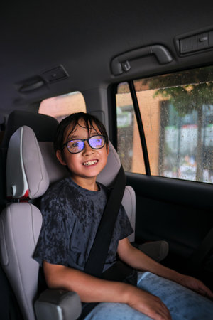 A boy in a car gets wet.の写真素材