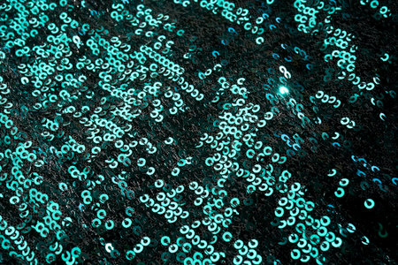 Christmas abstract background made of emerald green sequins.