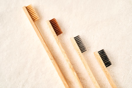 Toothbrushes on a white terry towel.