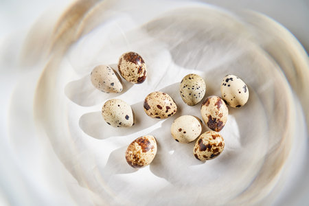 Quail eggs on a white linen towel close-up.
