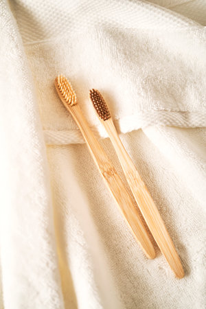 Toothbrushes on a white terry towel.の写真素材