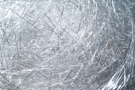 Abstract Christmas background made of tinsel with bokeh.の写真素材