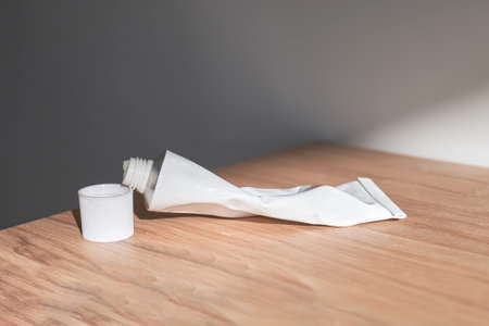 Tube with moisturizing cream in the sun.
