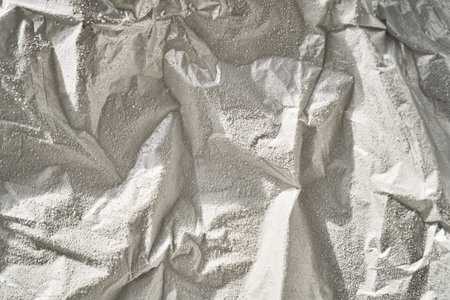 Abstract background from frozen silver foil in frost.の写真素材