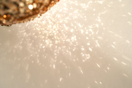 Reflections of a golden Christmas ball on a white background.の写真素材