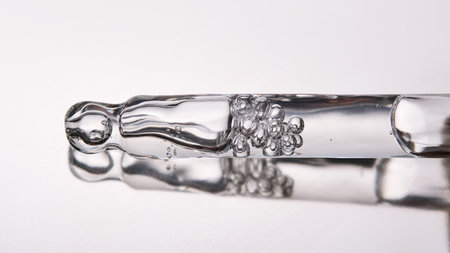 Pipette with cosmetic gel or serum close-up.の写真素材