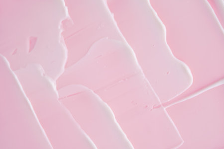 Swatch with white cream texture on a pink background.の写真素材