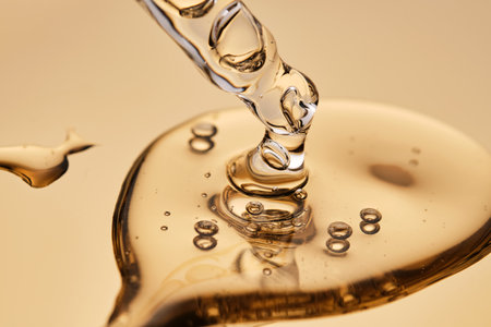 A pipette with a beautiful drop of gel-textured facial serum.の写真素材