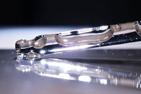 A serum pipette on a dark background.の写真素材