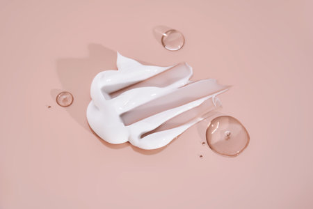 The texture of white cream on a pink background.の写真素材