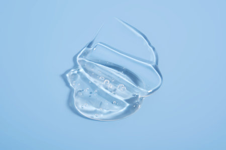 The texture of a cosmetic gel on a blue background.の写真素材