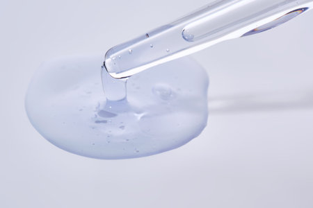 Pipette with delicate blue serum close-up.の写真素材