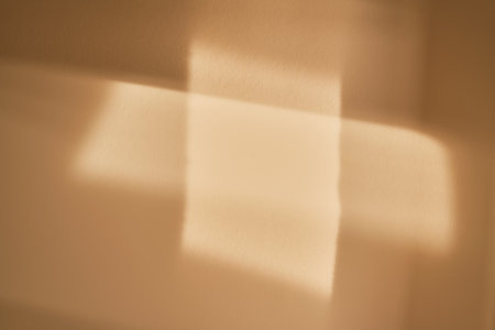 Beige background with beautiful highlights. Perfect for text.