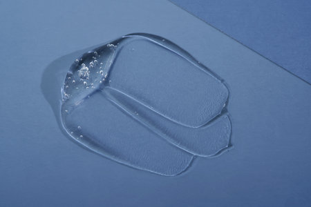 Cosmetic gel on a blue background. Texture.