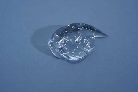 Cosmetic gel on a blue background. Texture.