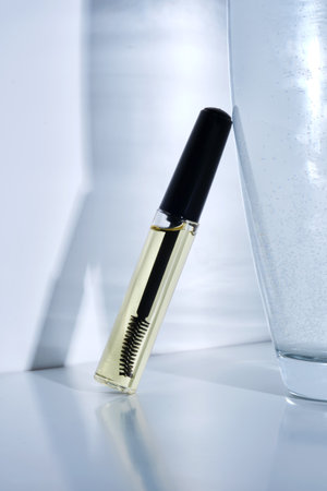 Bottle with brush filled with oil for eyebrow and eyelash growth.の写真素材