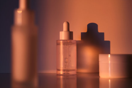 A set of cosmetics in the rays of the setting sun.の写真素材