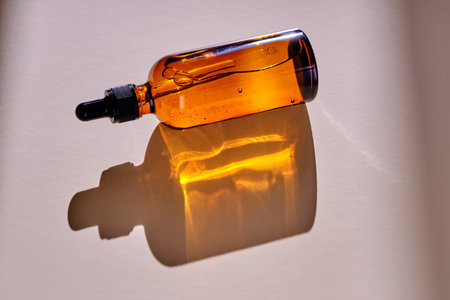 Face serum in a dark bottle in the sunlight.の写真素材