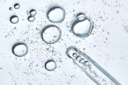 The texture of hyaluronic serum with lots of bubbles with a pipette.の写真素材