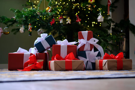 Lots of Christmas presents under the decorated Christmas tree.の写真素材