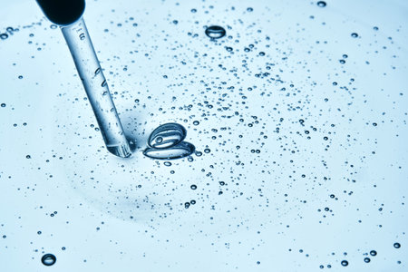 A drop of cosmetic product with abundant bubbles in blue tones.の写真素材