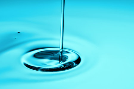 The oil flows and collects into a drop. The texture of the product.の写真素材