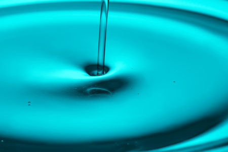 A very beautiful drop with an oily texture in turquoise tones.の写真素材