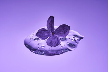 A textured drop of serum with lilac.