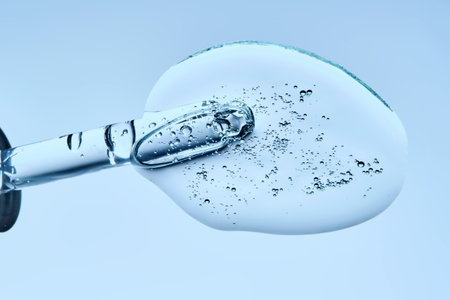 The texture of a serum or cosmetic gel with a dropper.の写真素材
