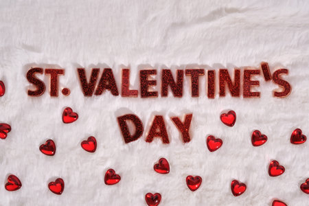 Festive St. Valentines Day background on a white plush background with hearts.の写真素材