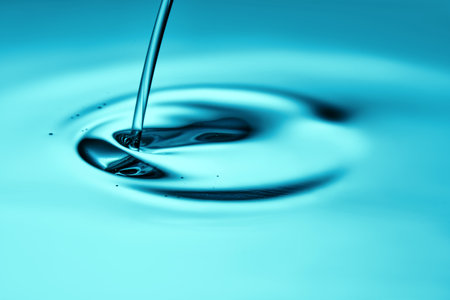 The oil flows and collects into a drop. The texture of the cosmetic product.の写真素材