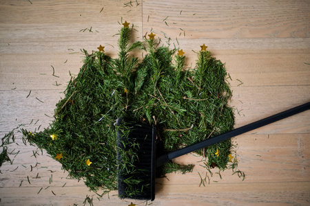 A broom that sweeps the needles from the Christmas tree.