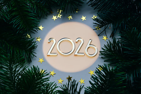 Yellow New Years background with the number of the coming year 2026.