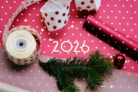 New Year 2026 red background. Number of the coming year in Christmas decoration.