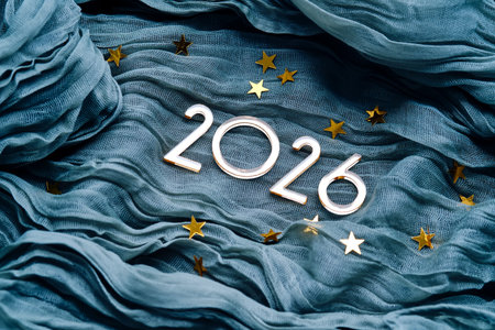New Years background with the number 2026 on a blue background.の写真素材