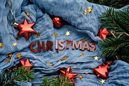 Blue fabric background with the inscription Christmas for your congratulations.