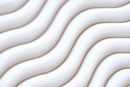 Beautiful waves of cream close-up. Beauty background.の写真素材