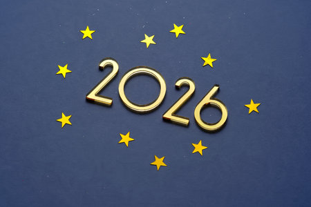 Abstract festive blue background with golden stars and the number is 2026.