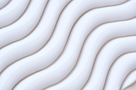 Beautiful waves of cream close-up. Beauty background.