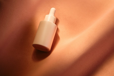 Bottles of facial serum in the soft sunset light.の写真素材