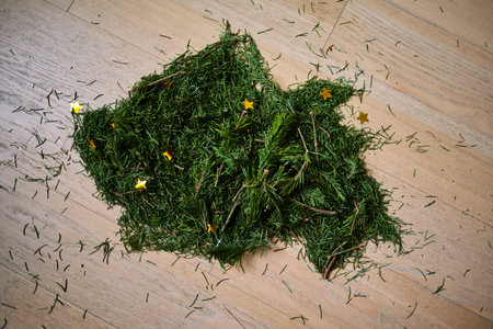 A broom that sweeps the needles from the Christmas tree.
