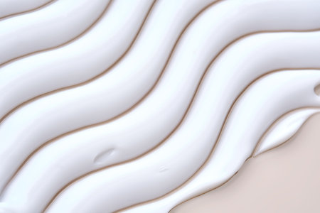 Beautiful waves of cream close-up. Beauty background.の写真素材